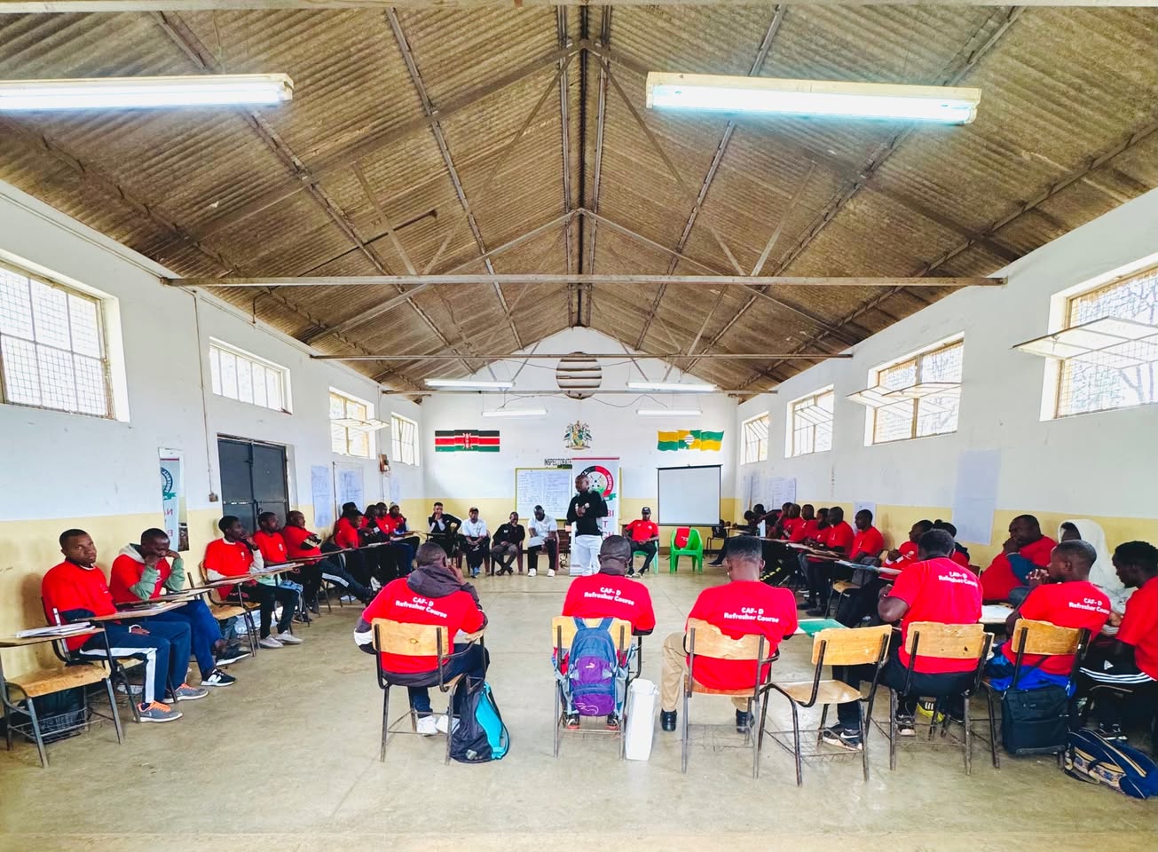Coaches seated in a circle during a CAF D refresher course run by the branch